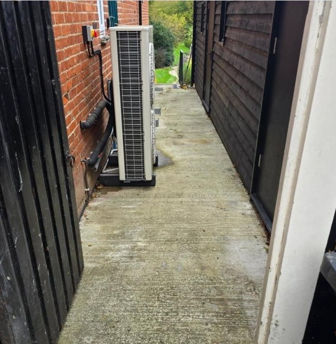Mossy, grimy side pathway before cleaning